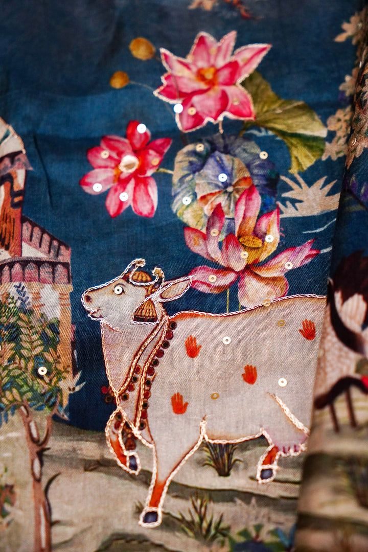 Soft Sky Blue Printed Crepe Silk Saree Featuring Artistic Figure Designs