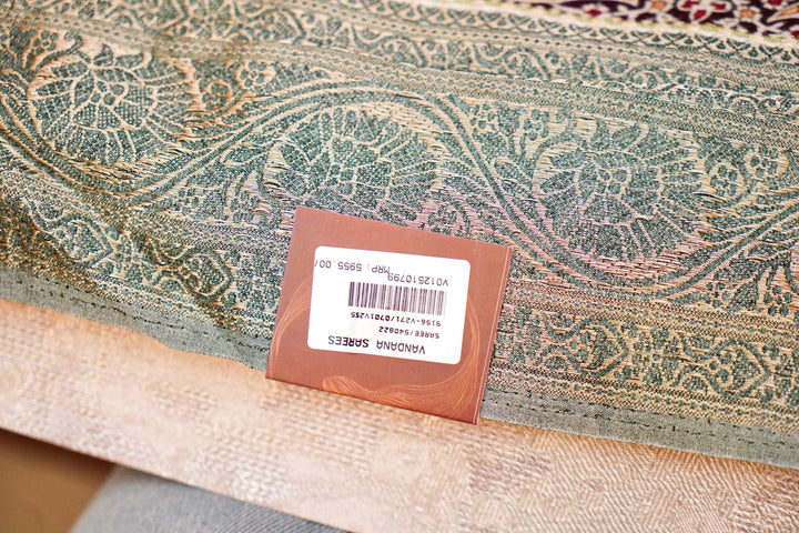 Teal Green Crepe Silk Saree with Statement Figure Motifs