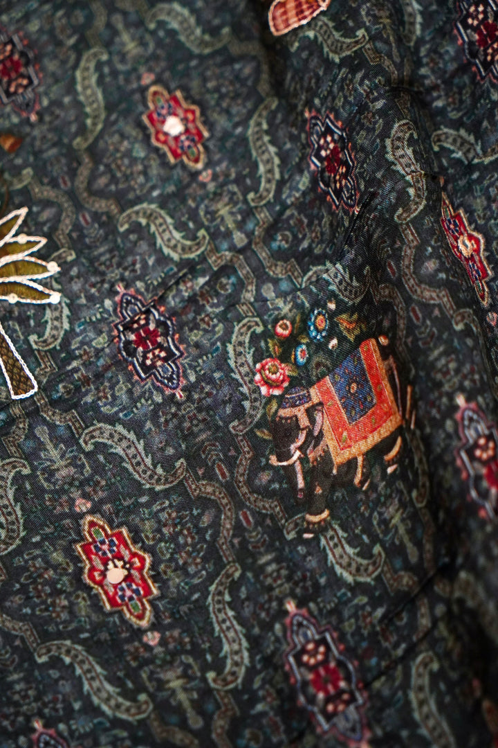 Teal Green Crepe Silk Saree with Statement Figure Motifs