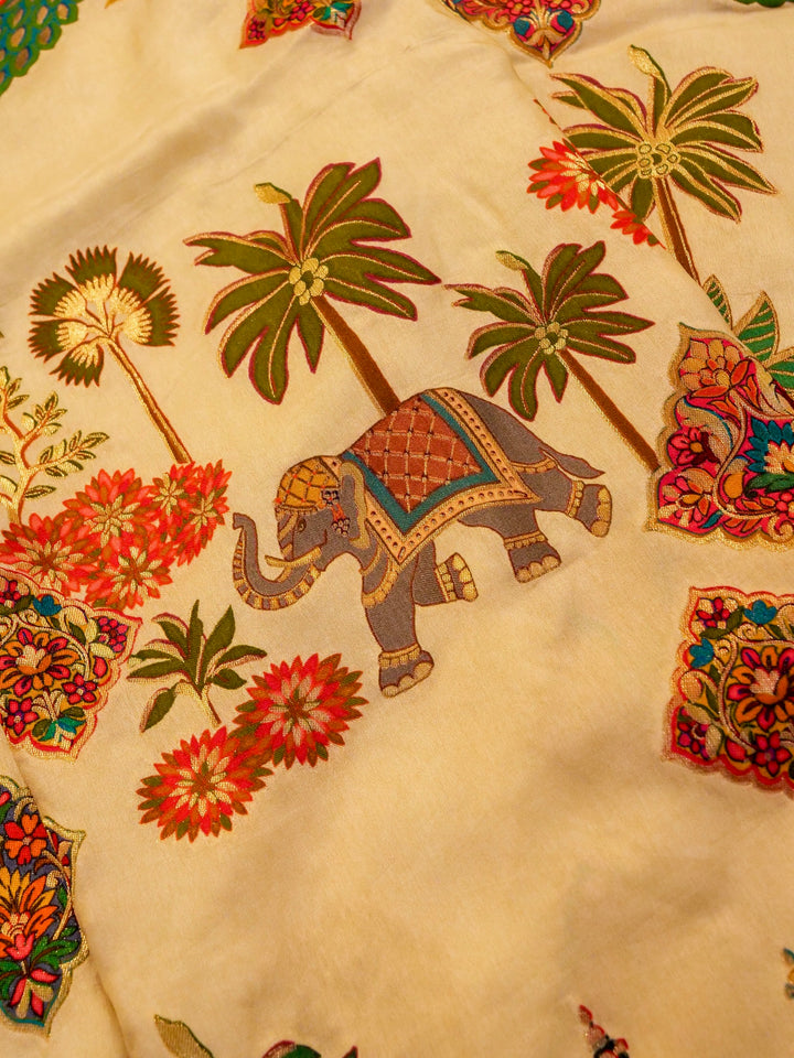 Whispers of Nature Beige Crepe Silk Saree with Bird and Figure Motifs