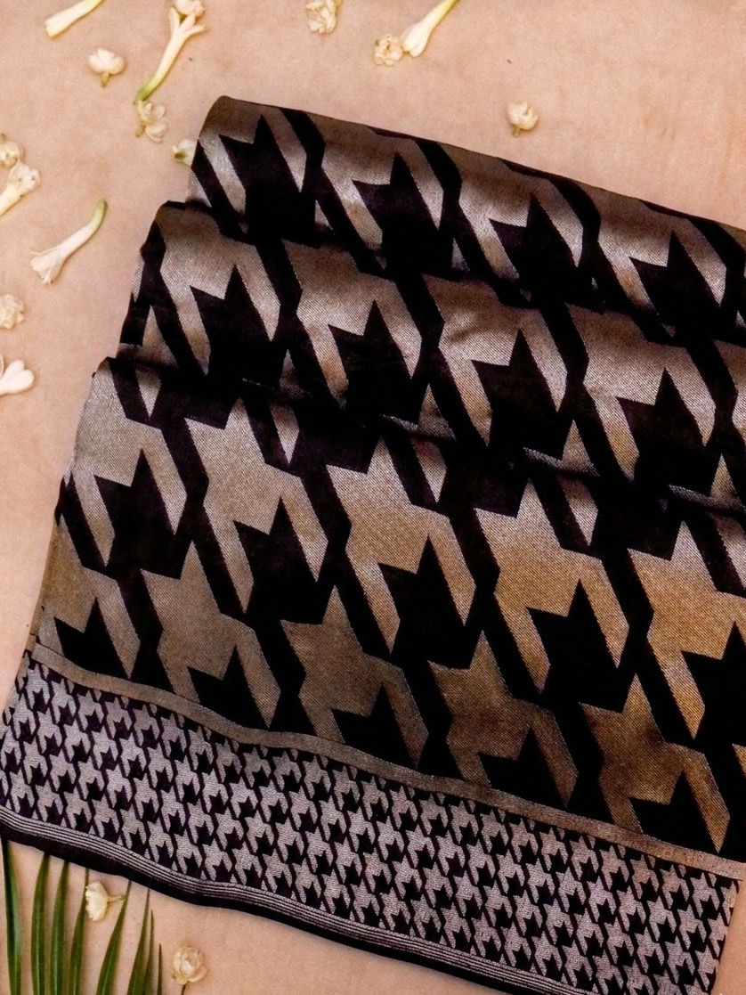 Black and white patterned fabric on a beige background