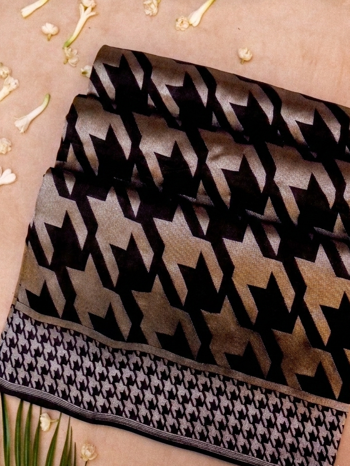 Black and white patterned fabric on a beige background
