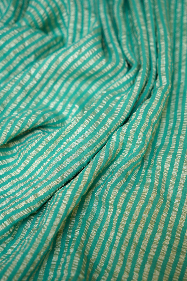 Refreshing Aqua Green Muga Georgette Saree with Zari Stripes