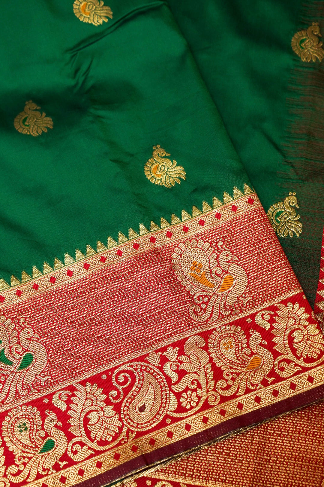Bottle Green Soft Silk Kanjivaram Inspired Bird Motifs Saree with Red Contrast Border Pallu
