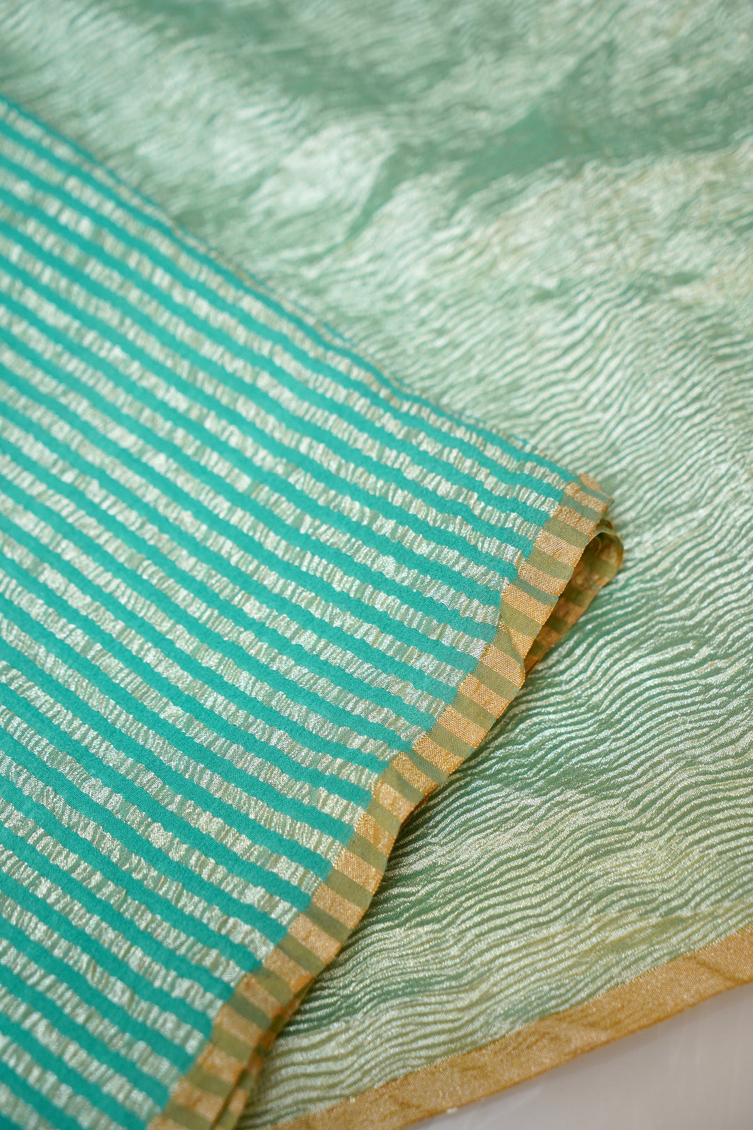 Refreshing Aqua Green Muga Georgette Saree with Zari Stripes