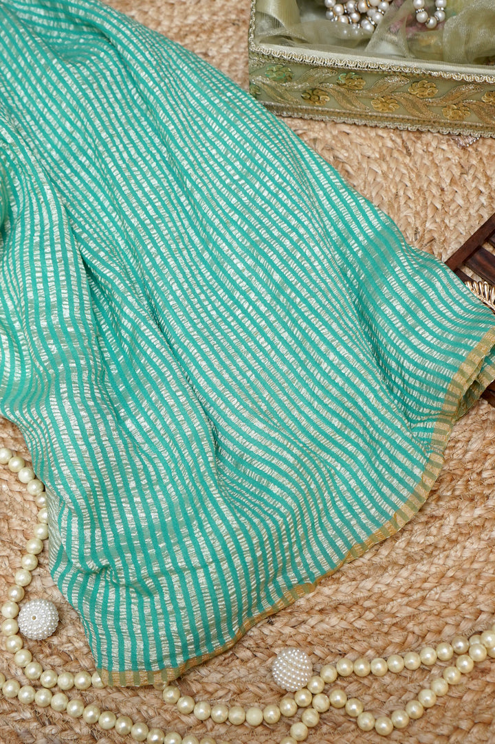 Refreshing Aqua Green Muga Georgette Saree with Zari Stripes