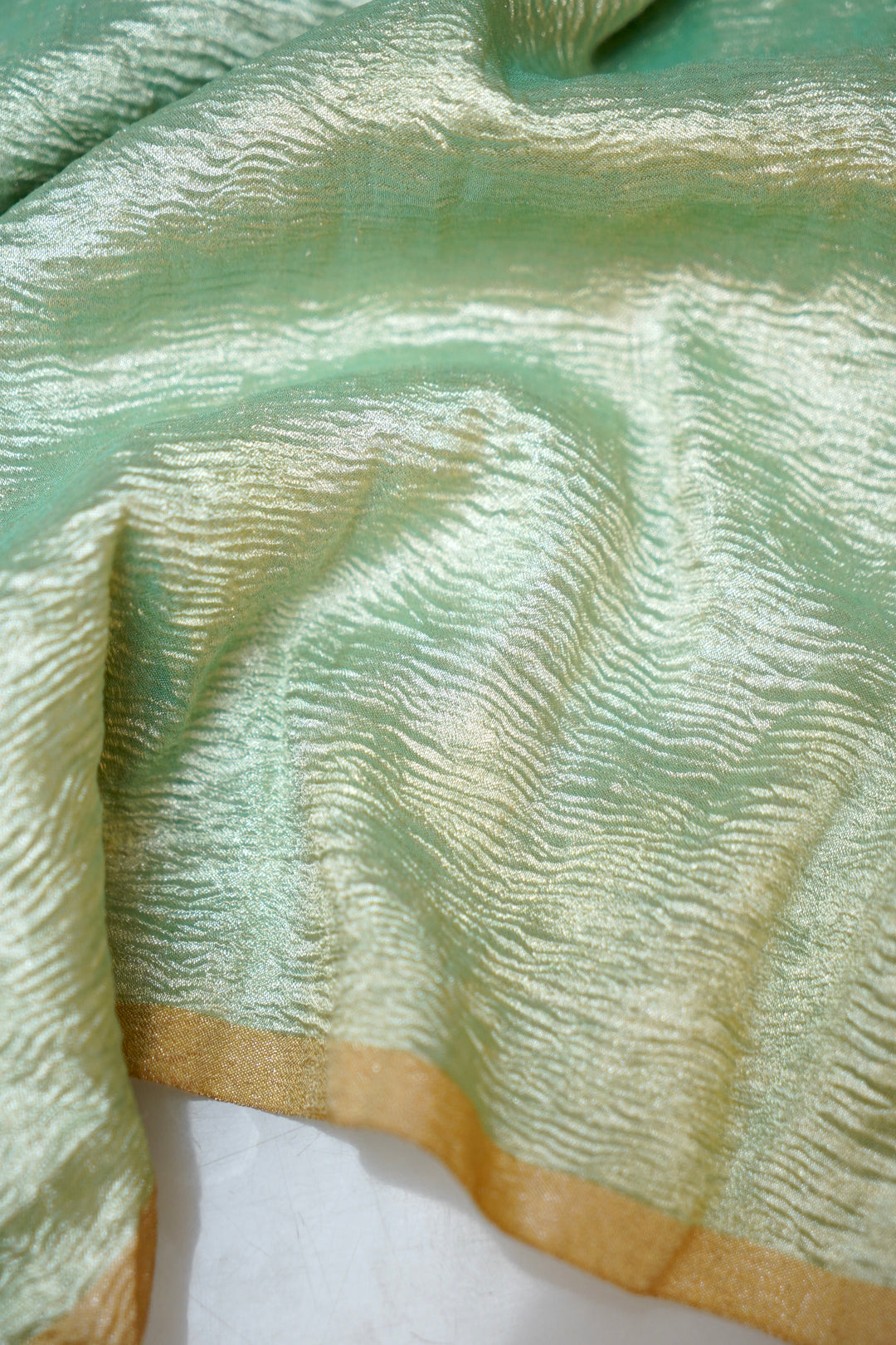 Refreshing Aqua Green Muga Georgette Saree with Zari Stripes