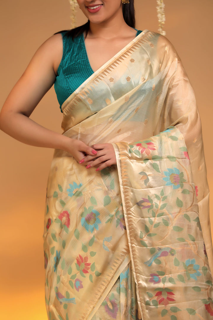 beige kota silk meenakari figure motif saree with silk weaving border closeup view