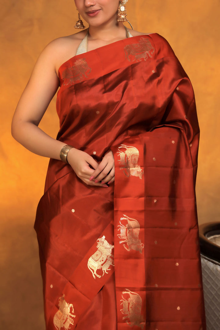 handwoven banarasi pure mashru silk kamdhenu motif satin border saree rust orange closeup view