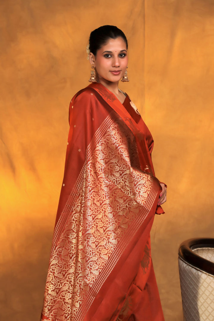 handwoven banarasi pure mashru silk kamdhenu motif satin border saree rust orange side view 3