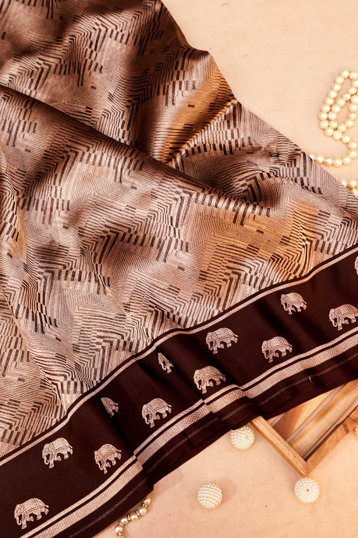 Majestic Earth – Brown Pure Handloom Organza Silk Saree with Elephant Motif Border