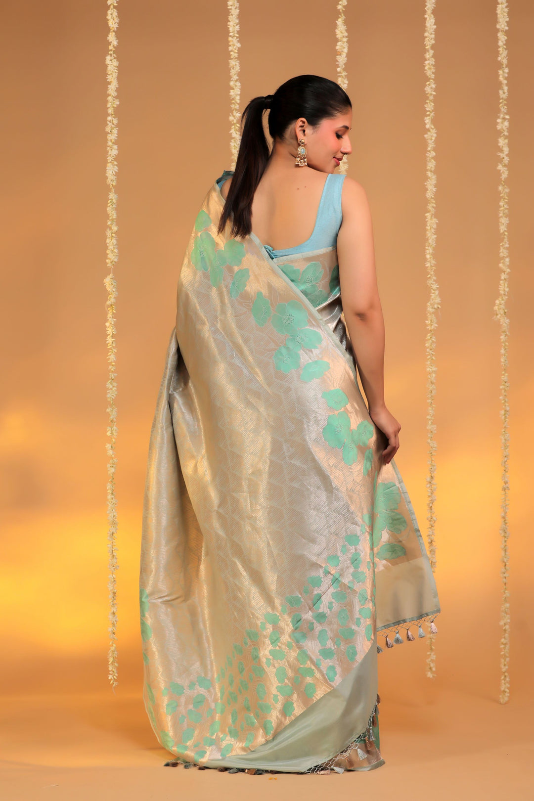 banarasi handloom pastel green pure katan silk structured floral grid motif saree back view