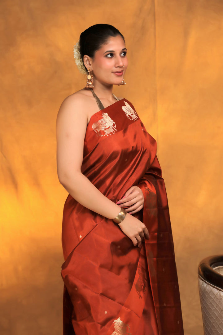 handwoven banarasi pure mashru silk kamdhenu motif satin border saree rust orange side view 2