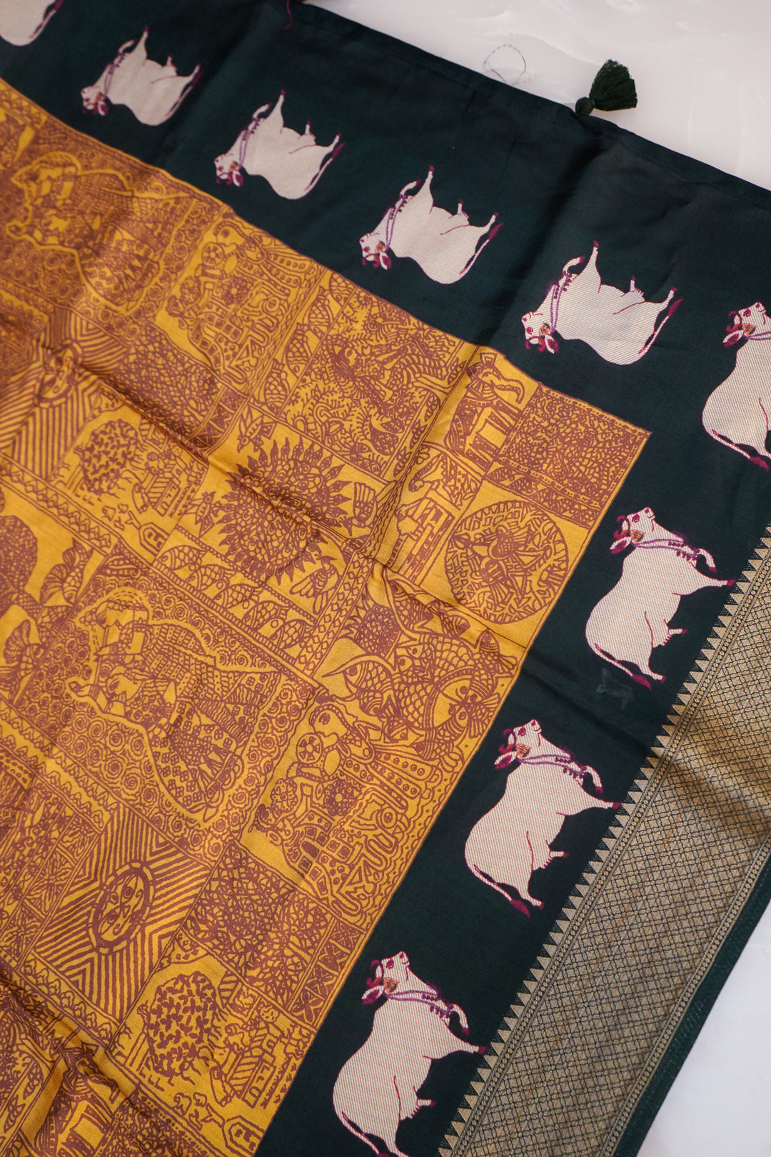 Mustard Crepe Silk Saree with Green Contrast Nandi Motif Pallu &amp; Border