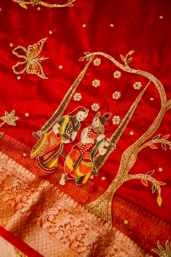 Ruby Red Maharani Tissue Silk Radha Krishna Motif Saree View 4