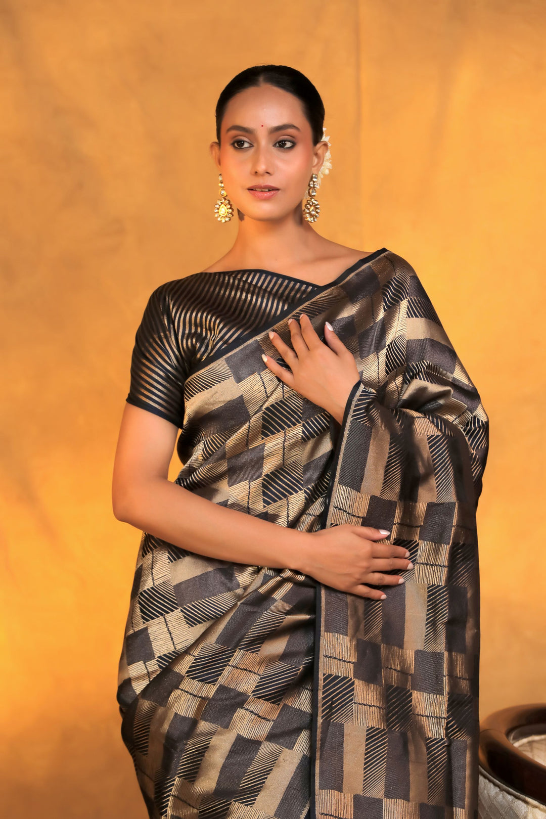 handwoven banarasi brocade black and golden pure katan silk saree closeup view