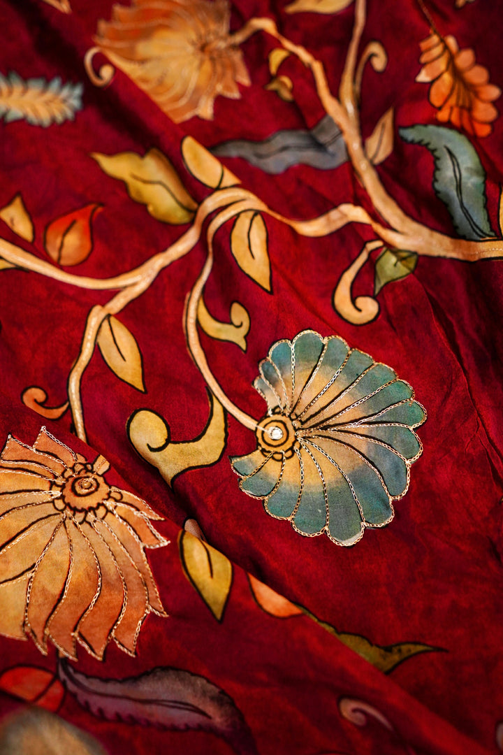 Regal Maroon Elegance: Crepe Silk Saree with Floral Prints