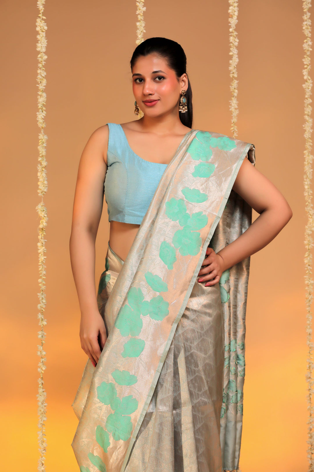 banarasi handloom pastel green pure katan silk structured floral grid motif saree closeup view 1