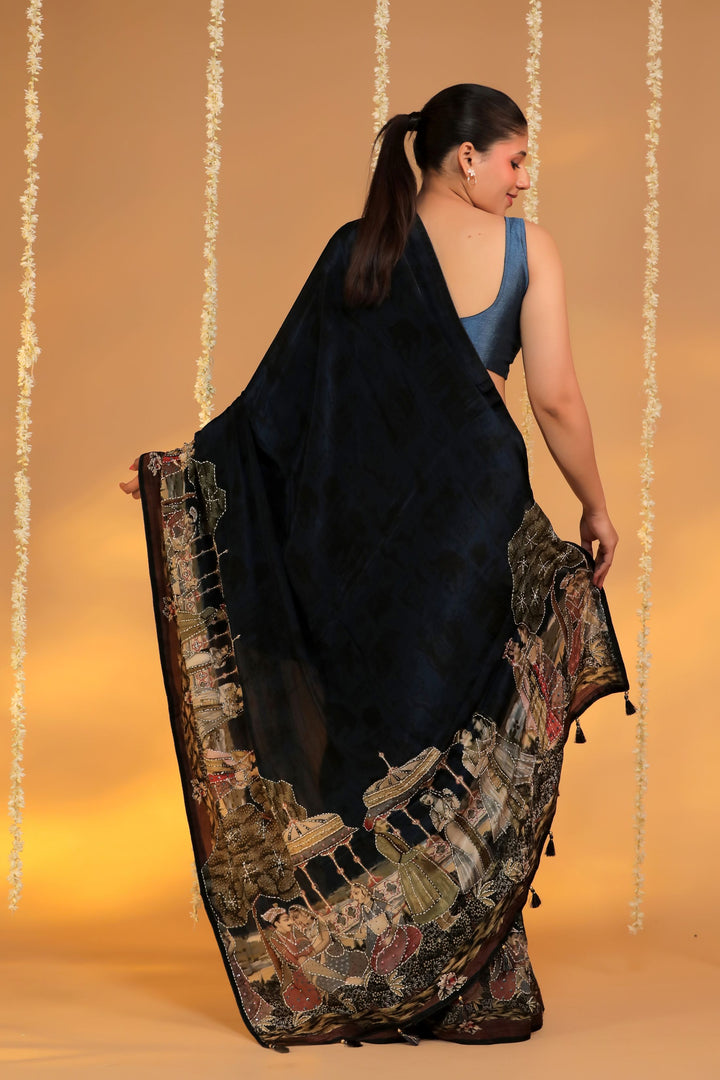teal blue crepe silk katha embroidery figure motif saree for cocktail back view 