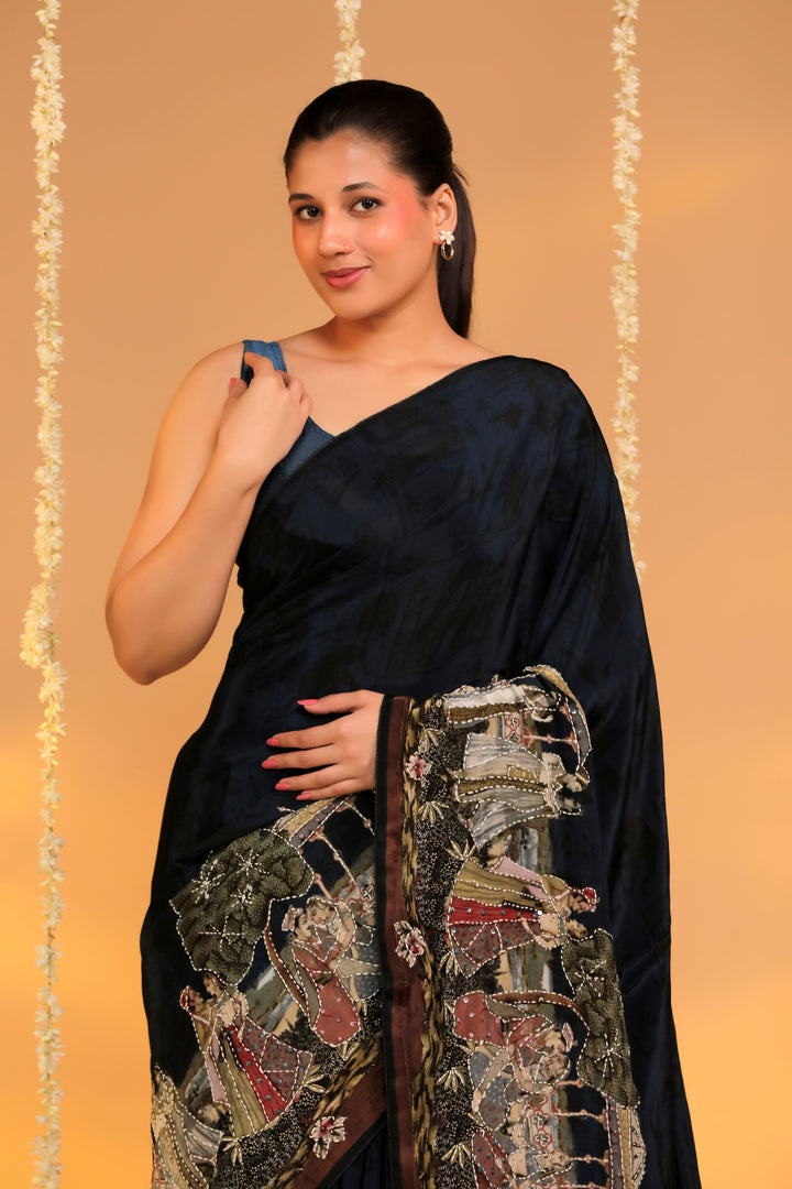 teal blue crepe silk katha embroidery figure motif saree for cocktail closeup view 1